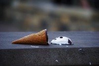 An ice-cream cone dropped on the ground
