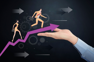 Businessman holds a graph as people run up it, symbolising progression and success in the business world.