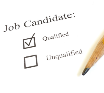 Candidate reviewing qualifications and skills on a checklist during a the CV writing process.
