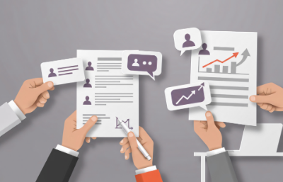 Hands holding documents featuring colorful graphs and charts, illustrating data analysis and trends.