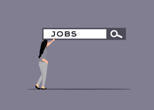 A woman holds a job sign, contemplating her prospects in the finance and accountancy job market.