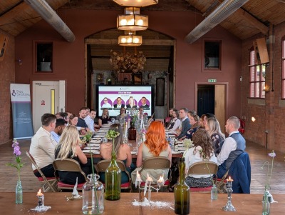 Future CFOs seated at a table in a Victoria in Kelham Island, engaged in listening to speeches from current CFOs during our Future CFO's Networking event. 