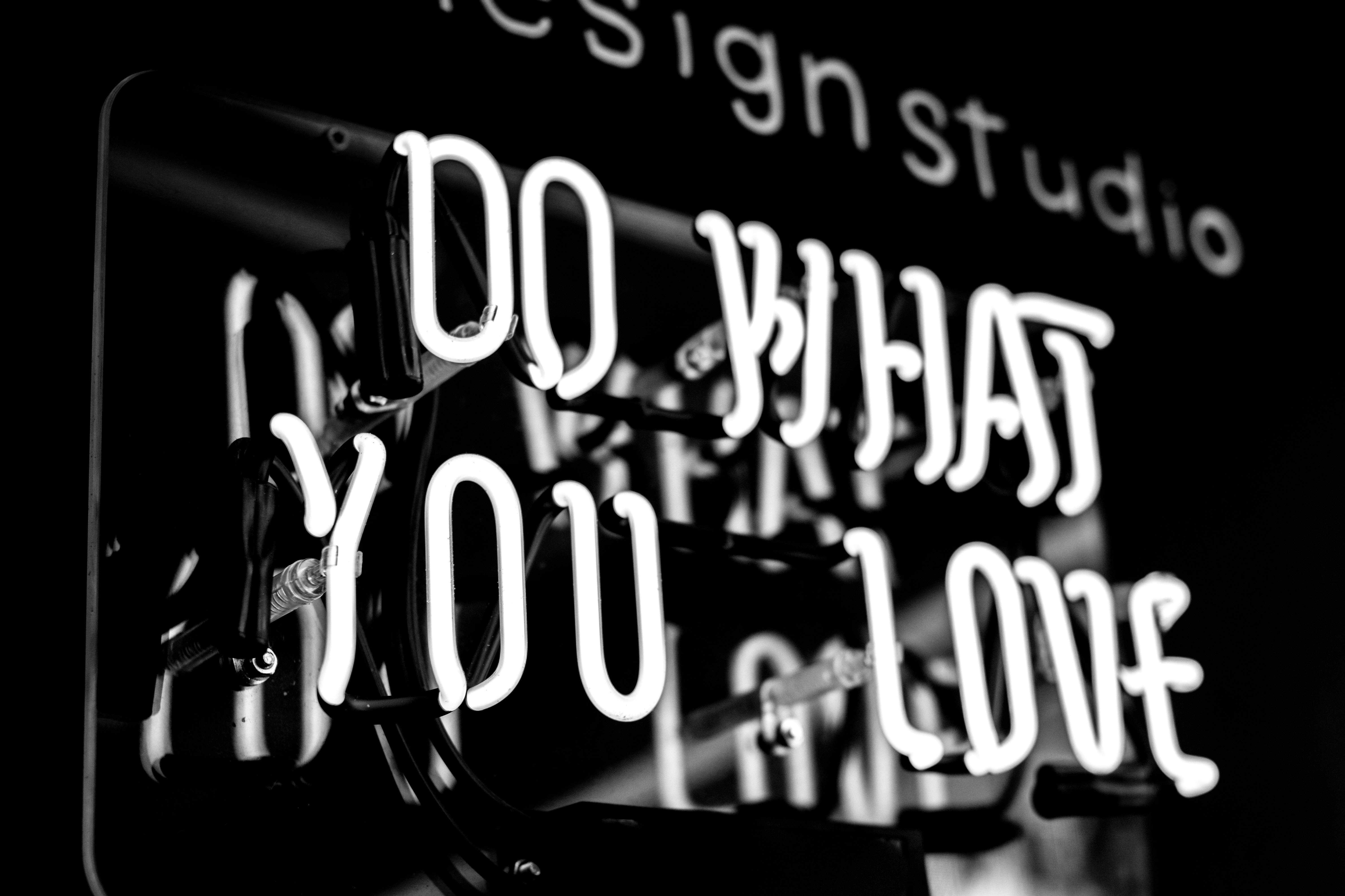 Neon light up sign saying 'do what you love'.