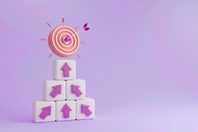  A stack of cubes with arrows directing towards a target, symbolising focus and goal achievement.