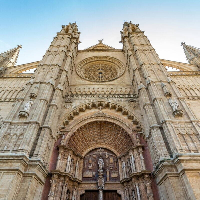 The majestic Catedral-Basílica de Santa María de Mallorca, highlighting its detailed façade and towering spires in Barcelona, Spain.