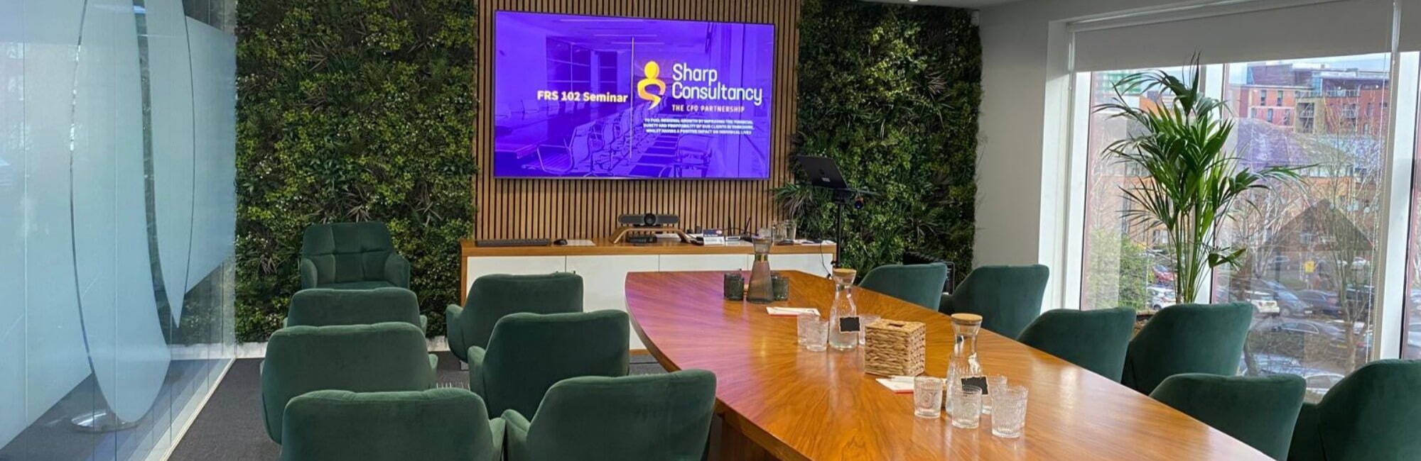 FRS 102 Seminar hosted at Shorts Chartered Accountants in Sheffield in their modern board room with green velvet chairs and natural and wooden décor.