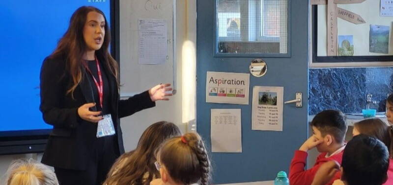 Deanna Crosby delivering a careers chat in a class room to a school in Sheffield.